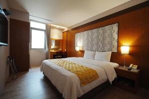 Postel nebo postele na pokoji v ubytování York Hotel