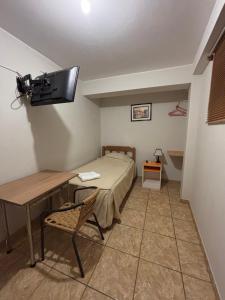 TV a/nebo společenská místnost v ubytování Hospedaje el Telar
