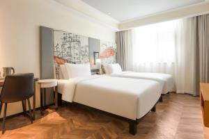 Ibis Styles Hotel - Xi'an Big Wild Goose Pagoda Historical Museum Branch 객실 침대