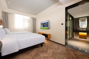 Ibis Styles Hotel - Xi'an Big Wild Goose Pagoda Historical Museum Branch 객실 침대