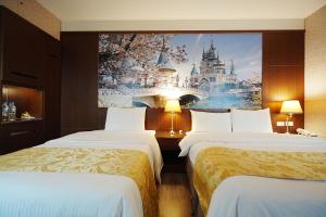 Postel nebo postele na pokoji v ubytování York Hotel