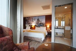Postel nebo postele na pokoji v ubytování York Hotel
