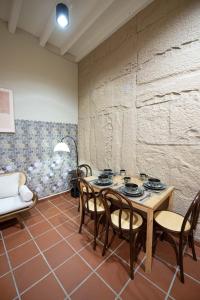 a dining room with a table and chairs at DeLuma - Lebuh Melayu 4 Bedroom in George Town