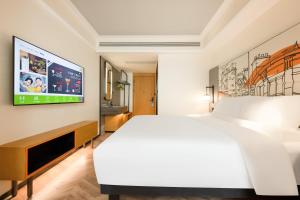 Ibis Styles Hotel - Xi'an Big Wild Goose Pagoda Historical Museum Branch 객실 침대