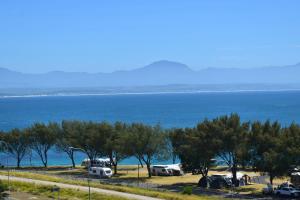 a group of cars parked next to the water at Hartklop Luxury Self Catering Guesthouse in Linkside