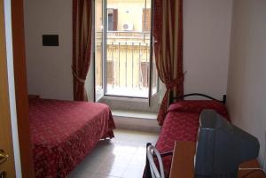 Postel nebo postele na pokoji v ubytování Hotel Euro Quiris