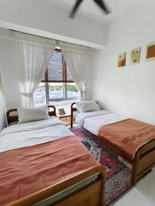Ένα ή περισσότερα κρεβάτια σε δωμάτιο στο ILHAM SURI Boho Apartment in Wakaf Che Yeh