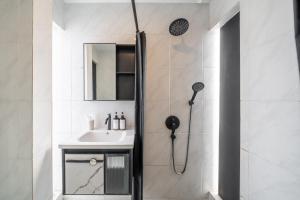 a bathroom with a shower and a sink at Sahadewa 46 - Dreamland Golf Complex 4 Bedroom in Uluwatu +14 photos