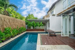 a swimming pool in the backyard of a house at Sahadewa 46 - Dreamland Golf Complex 4 Bedroom in Uluwatu