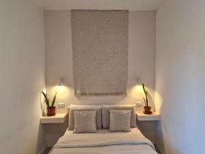 Postel nebo postele na pokoji v ubytování Stazione Rooms