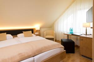 Ein Bett oder Betten in einem Zimmer der Unterkunft Spreewaldhotel Stephanshof