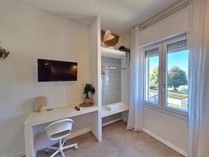 TV a/nebo společenská místnost v ubytování Stazione Rooms