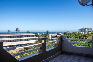 a balcony with a view of the ocean at No5 on Golden Sands in Margate