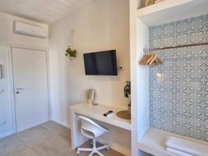 TV a/nebo společenská místnost v ubytování Stazione Rooms
