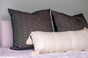 two pillows on top of a bed with at No5 on Golden Sands in Margate