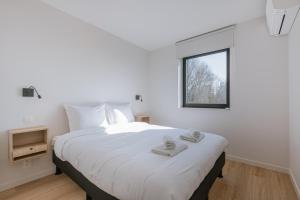 Postel nebo postele na pokoji v ubytování Maison Ariël