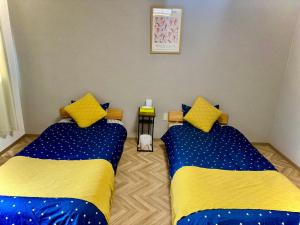 Voodi või voodid majutusasutuse Summit Villa 中崎町駅3分鐘 梅田商圈大阪駅 3階日式傳統町屋 100平超大空間 toas