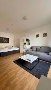 Postel nebo postele na pokoji v ubytování Praktische City Apartments direkt am Hauptbahnhof