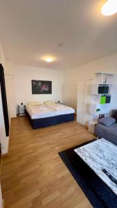 Postel nebo postele na pokoji v ubytování Praktische City Apartments direkt am Hauptbahnhof