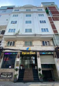 a building with a sign on the front of it at Thái An Hotel Hồ Chí Minh in Ho Chi Minh City