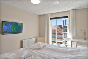 Postel nebo postele na pokoji v ubytování Hotel Klitbakken