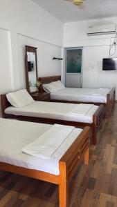 Postel nebo postele na pokoji v ubytování Lagoon Breeze Resort