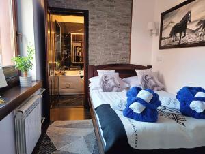 Televízia a/alebo spoločenská miestnosť v ubytovaní Pokoje i apartamenty u Sabiny - DOSTĘP DO JACUZZI TYLKO W WYBRANYCH OPCJACH sprawdź poniżej szczegóły rezerwacji