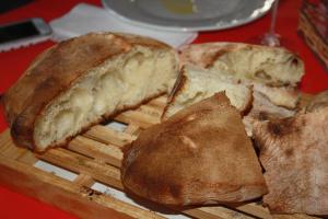a plate of bread on a table at Señorío de Monterruiz in Casas de Santa Cruz