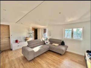 a living room with a couch and a table at Le castelet in Le Castellet