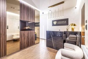 a salon with two chairs and a table at ZAGABRIA - Modern Boutique Studios by Main Square in Zagreb