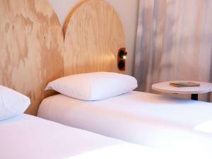 Ένα ή περισσότερα κρεβάτια σε δωμάτιο στο ibis Styles Montauban