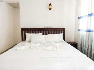 Letto o letti in una camera di Better Yala Home