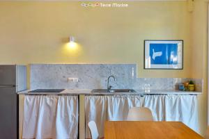 a kitchen with a sink and a counter top at Twilight, Terre Marine in Lerici