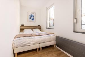 Posteľ alebo postele v izbe v ubytovaní Le Bras d'or Apparts et Spa