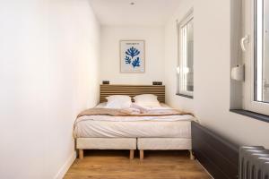 Posteľ alebo postele v izbe v ubytovaní Le Bras d'or Apparts et Spa