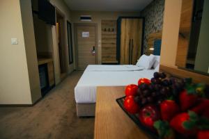 Ein Bett oder Betten in einem Zimmer der Unterkunft Hotel Via Serdika