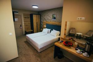Ein Bett oder Betten in einem Zimmer der Unterkunft Hotel Via Serdika