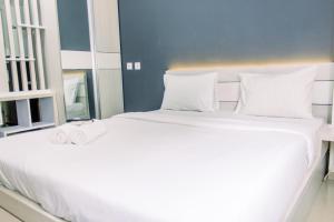 Katil atau katil-katil dalam bilik di Cozy and Tranquil Studio Apartment at Aeropolis Residence By Travelio