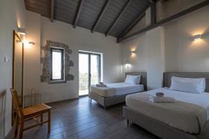 A bed or beds in a room at Torri di pietra