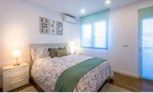 a bedroom with a bed and a dresser and a window at Lolena Calas De Torrevieja in Torrevieja +79 photos
