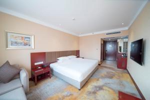 Uma televisão e/ou sistema de entretenimento em Wuhan Hongguang Hotel