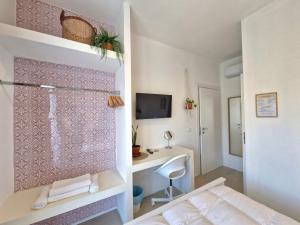Postel nebo postele na pokoji v ubytování Stazione Rooms