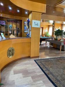 a lobby with a bar in a pharmacy at Hotel Sila in Camigliatello Silano +37 photos