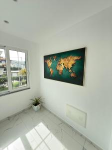 a white room with a map on the wall at Villa Denis Ksamil in Ksamil