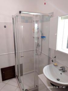 a bathroom with a shower and a sink at Alice e il mare in Alghero