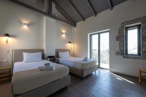 A bed or beds in a room at Torri di pietra