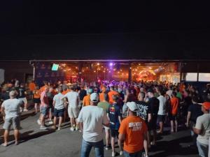 a large crowd of people standing in front of a stage at Campingplatz Orange Schindelbacherhof in Spielberg