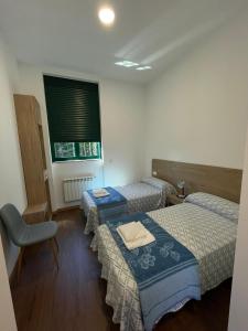 Posteľ alebo postele v izbe v ubytovaní Casa Diocesana VIA LUCIS + 37 fotografií