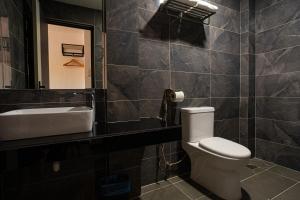Koupelna v ubytování De Quinton Hotel
