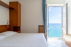 Posteľ alebo postele v izbe v ubytovaní Hotel Bellavista